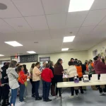 People checking out the 60+ baskets during the Breaking the Silence Mystery Bingo.