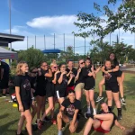 A silly picture of Rianna with her softball team.