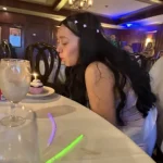 Rianna blowing out a candle at her Sweet 16.