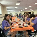 The Wilkins' family watching their bingo cards with such seriousness.