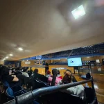 A photo of the Raub Middle School students hearing a presentation by our President.