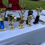 The trophies sitting on the registration table at the Ignite the Change car show.