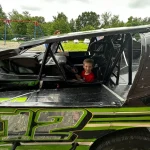 Little Waylon hanging out in the racecar.