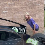 Kylee checking out the racecar.